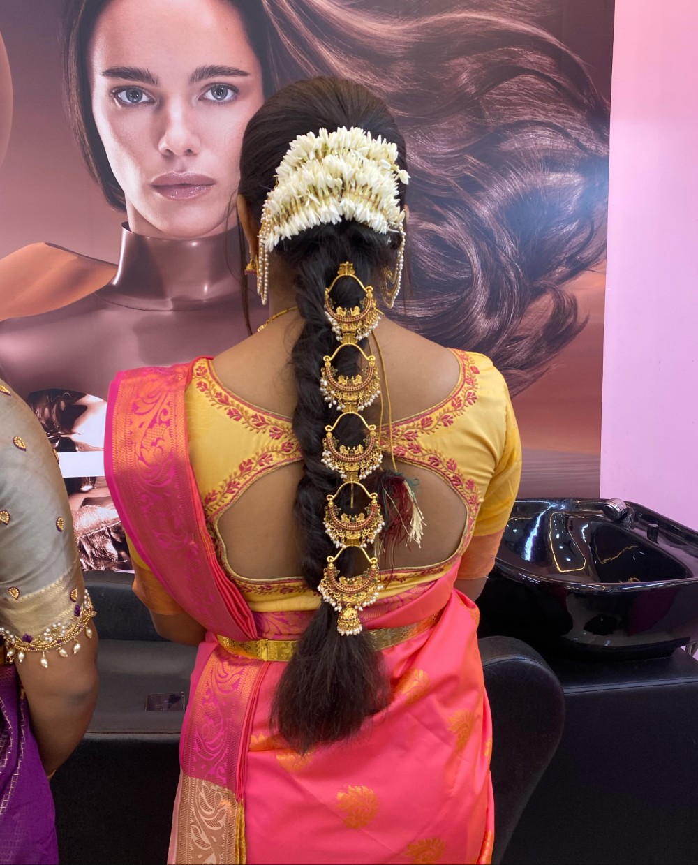 Traditional bridal braid with jasmine and gold jadai